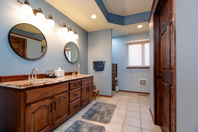 bathroom featuring tile patterned floors and vanity