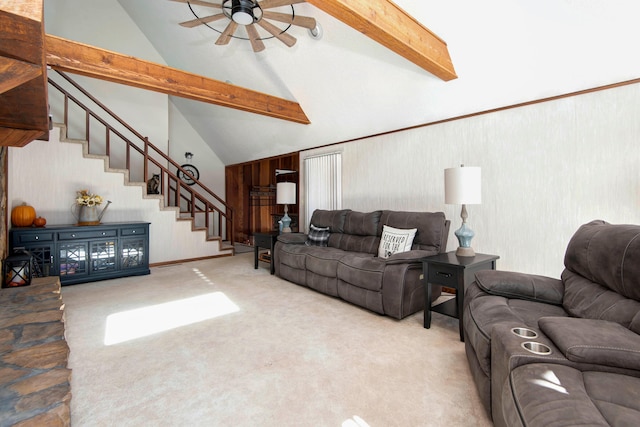 carpeted living room with beam ceiling, ceiling fan, and high vaulted ceiling