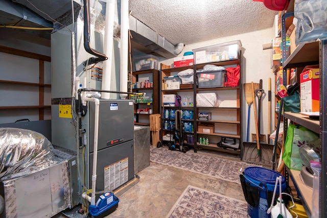 interior space with a textured ceiling and heating unit