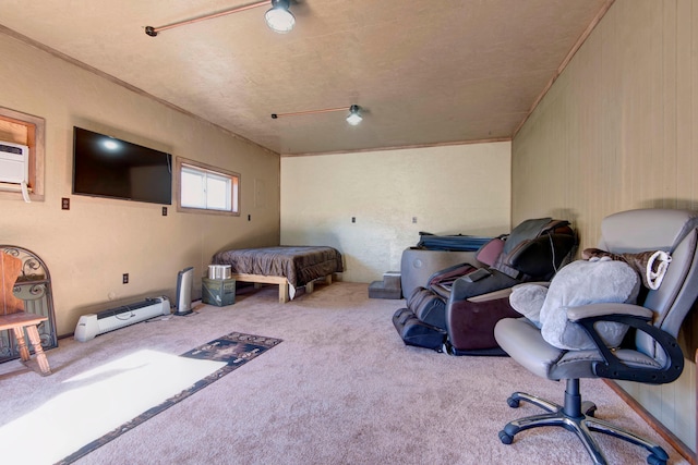 bedroom featuring a wall mounted air conditioner and carpet floors