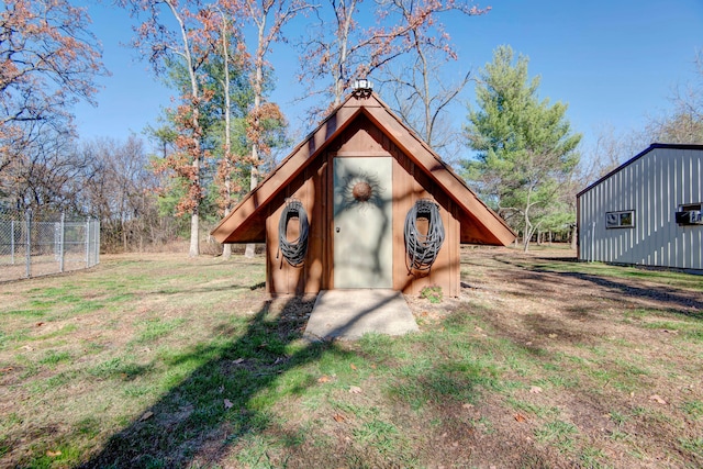 view of outbuilding with a lawn