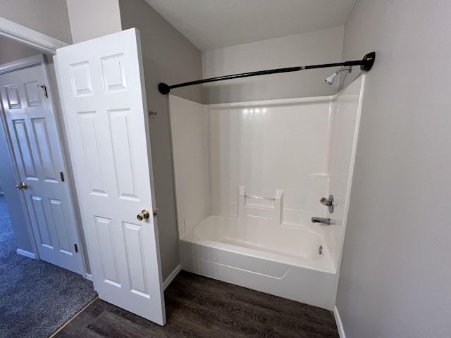66 Celebration Dr, Reeds Spring, MO 65737 - bathroom with shower / washtub combination, wood finished floors, and baseboards