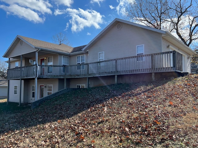 view of home's exterior featuring a deck