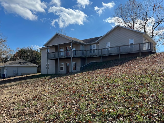 rear view of property with a deck