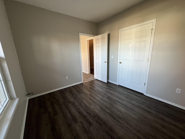 66 Celebration Dr, Reeds Spring, MO 65737 - unfurnished bedroom with dark wood finished floors and baseboards
