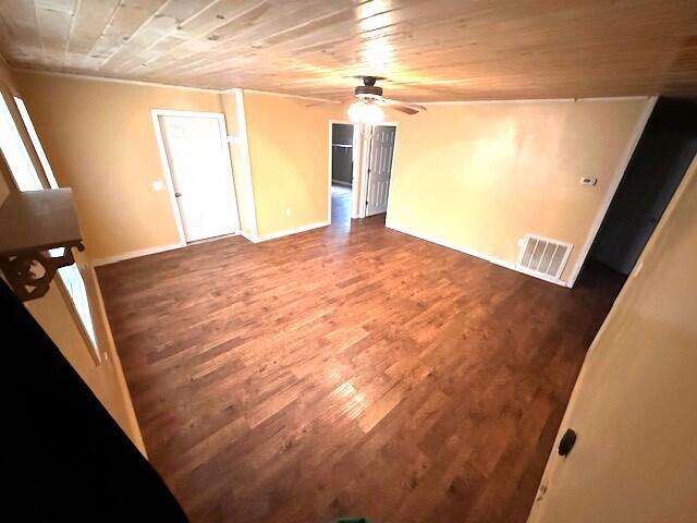 interior space featuring ceiling fan, wood ceiling, and dark hardwood / wood-style flooring