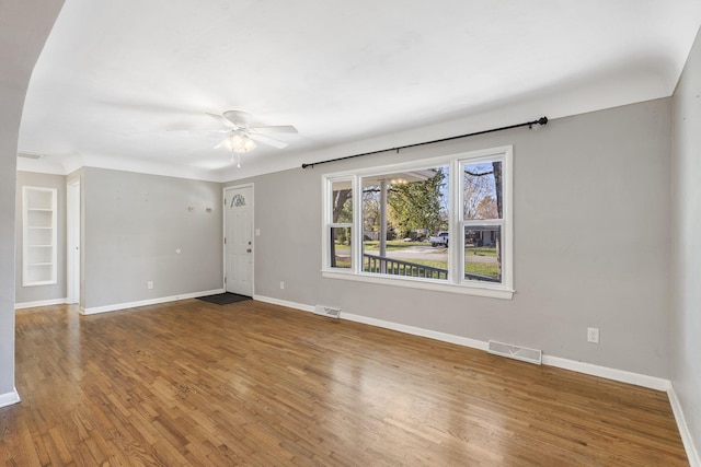 spare room featuring ceiling fan and wood-type flooring