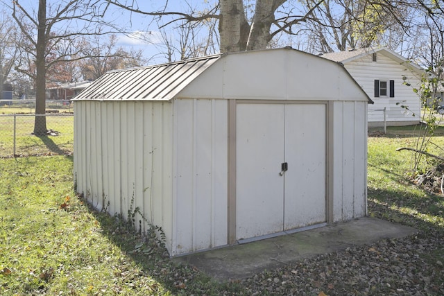 view of outdoor structure featuring a lawn