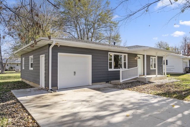 view of front of property featuring covered porch and a garage