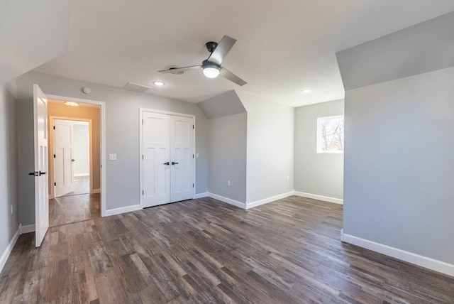 unfurnished bedroom featuring dark hardwood / wood-style flooring, a closet, and ceiling fan