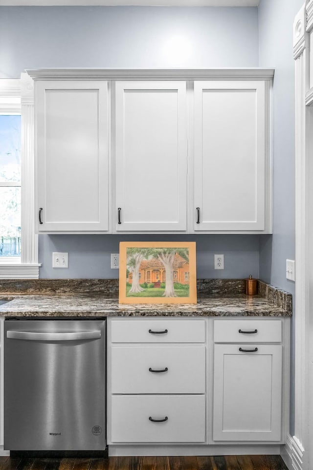 interior space featuring dishwasher, dark hardwood / wood-style floors, and white cabinetry