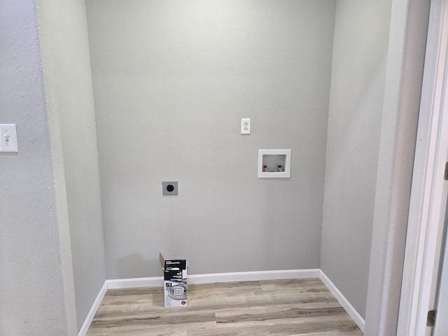 laundry room with hookup for an electric dryer, light wood-type flooring, and washer hookup