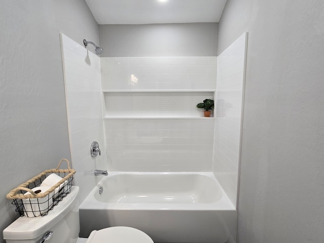 bathroom featuring bathtub / shower combination and toilet