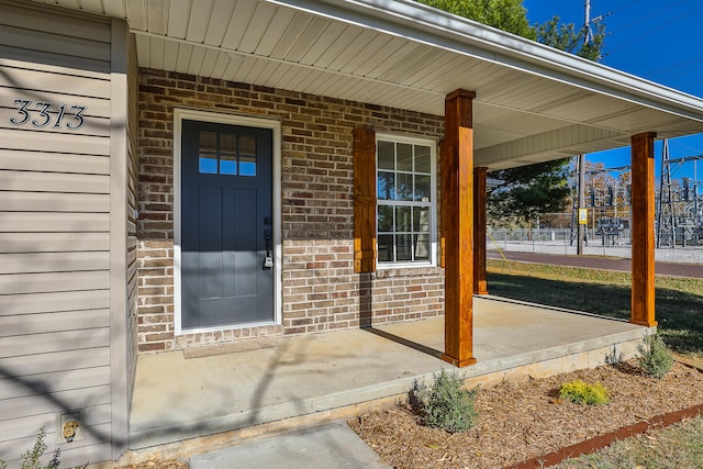 property entrance featuring covered porch