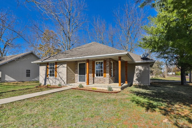 single story home featuring a front yard and a porch