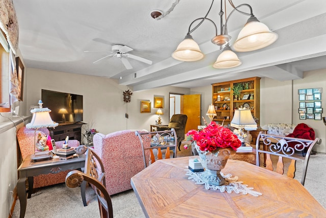 dining area with ceiling fan and light colored carpet