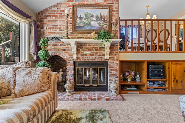 living room featuring a chandelier, carpet floors, a brick fireplace, and vaulted ceiling