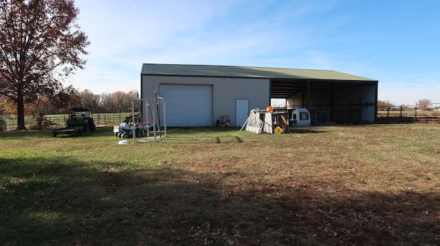 view of outbuilding with a yard