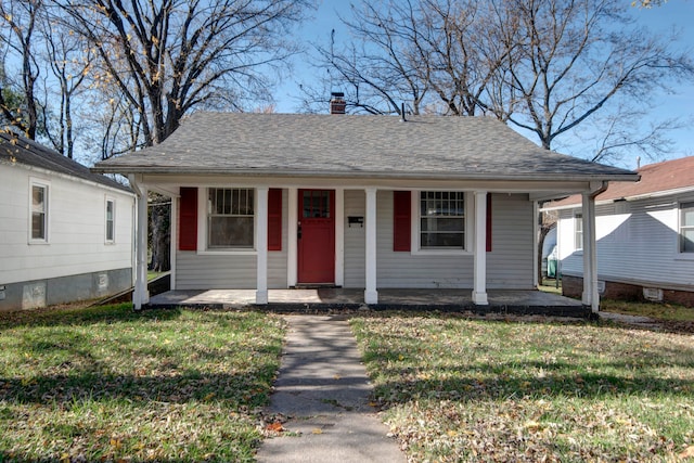 bungalow with a front lawn and a porch