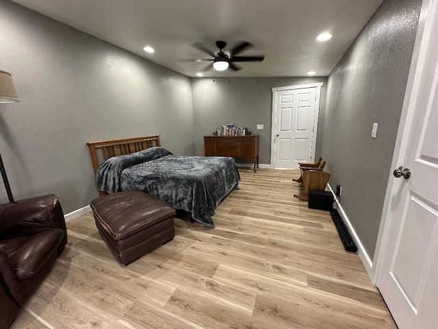 bedroom featuring light hardwood / wood-style flooring and ceiling fan