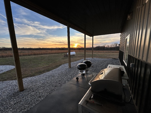 patio terrace at dusk with a rural view