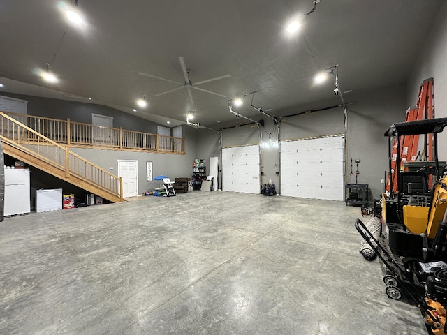 garage with white fridge and ceiling fan