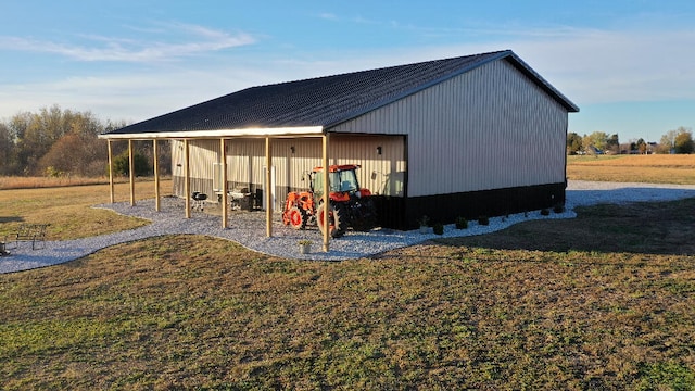 view of outdoor structure featuring a lawn