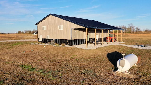 exterior space with a lawn and a rural view