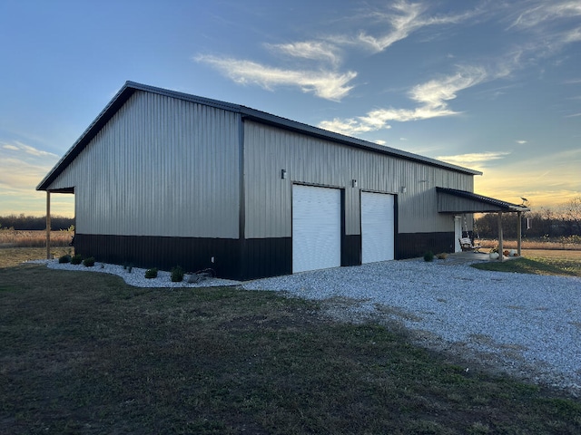 outdoor structure at dusk with a garage