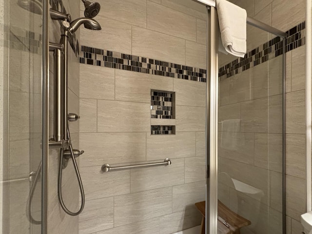 3830 Green Mountain Dr Unit 104, Branson, MO 65616 - bathroom featuring a shower stall and toilet