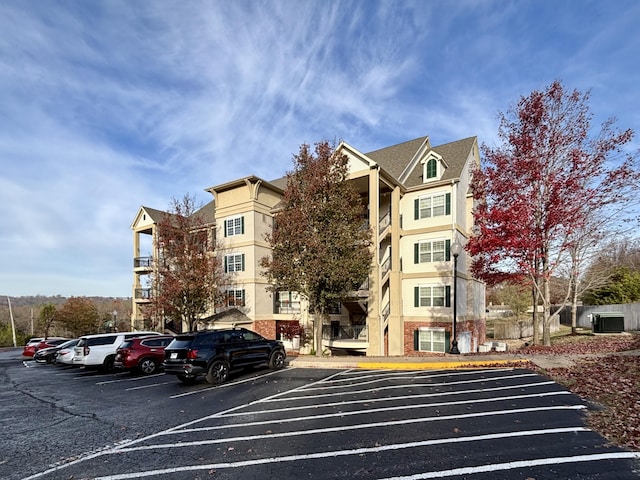 3830 Green Mountain Dr Unit 104, Branson, MO 65616 - view of building exterior featuring uncovered parking