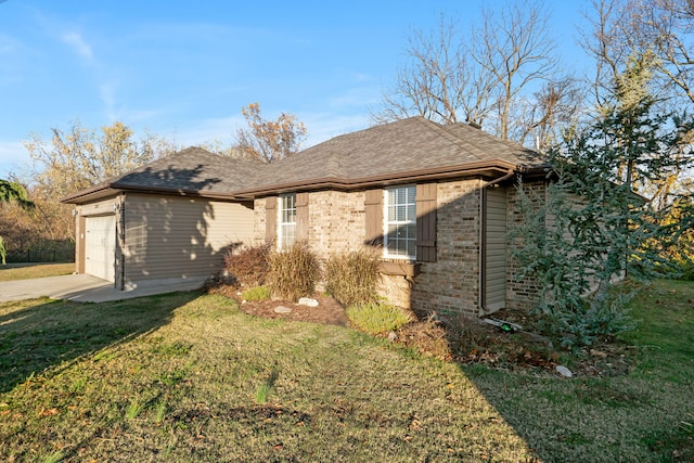 view of front facade with a front yard and a garage