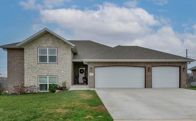 view of front of home with a garage and a front lawn