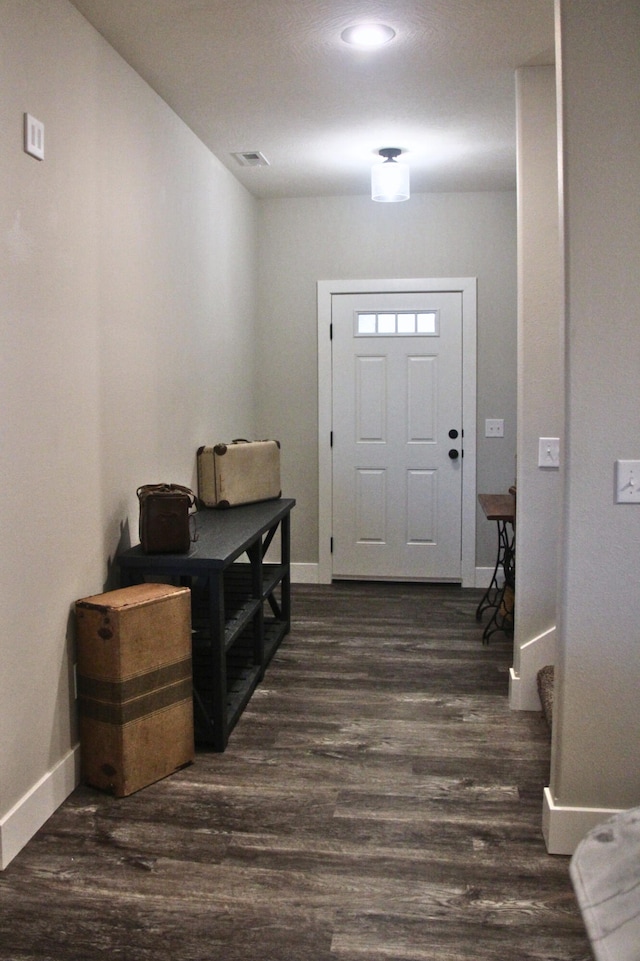 entrance foyer with dark hardwood / wood-style floors