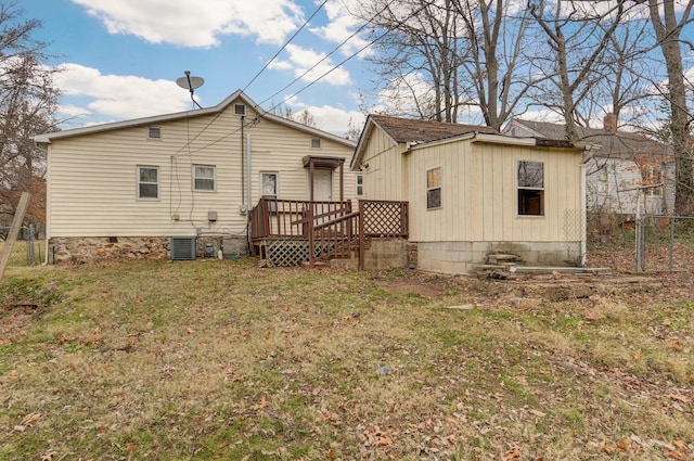 rear view of property with a lawn