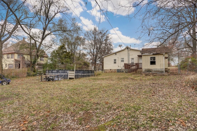 view of yard with a swimming pool side deck