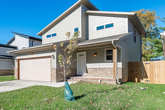 view of front of house featuring a front yard and a garage