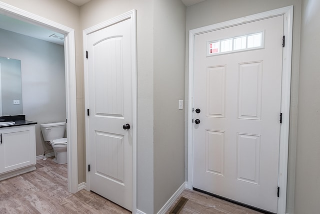 foyer with light wood-type flooring