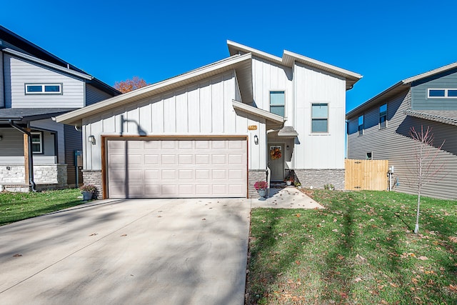 view of front of home featuring a garage and a front lawn