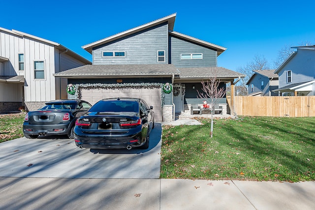 view of front facade featuring a garage and a front lawn