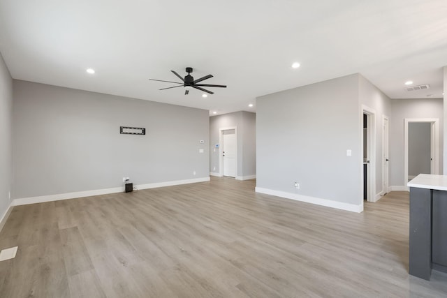 unfurnished living room with light hardwood / wood-style floors and ceiling fan