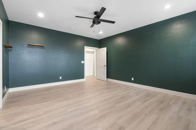 interior space with ceiling fan and light hardwood / wood-style floors