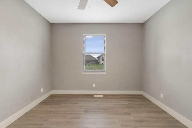 spare room featuring ceiling fan and light hardwood / wood-style floors