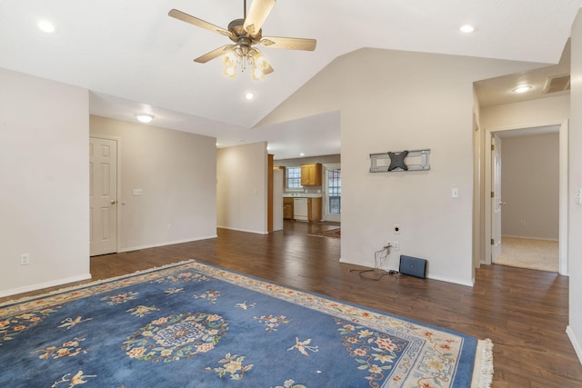 unfurnished living room with ceiling fan, dark hardwood / wood-style floors, and lofted ceiling