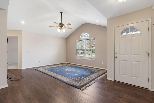 foyer entrance featuring lofted ceiling, ceiling fan, and dark hardwood / wood-style floors