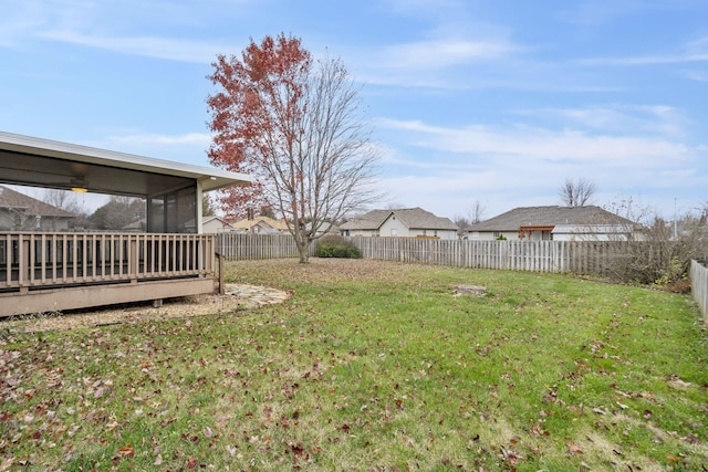 view of yard with a sunroom