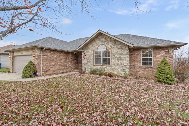 single story home featuring a garage