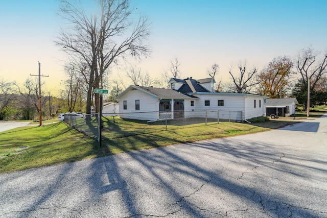 view of front of property with a lawn