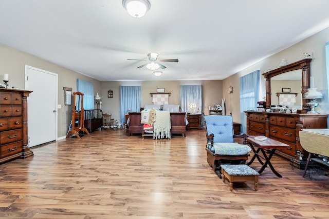 sitting room featuring ceiling fan and light wood-type flooring