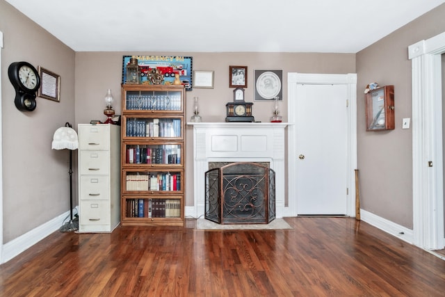 unfurnished living room featuring dark hardwood / wood-style flooring